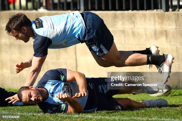 Angus Crichton of the Blues jumps over team mate Boyd Cordner of the Blues during a New South Wales Blues State of Origin training session at Coogee...
