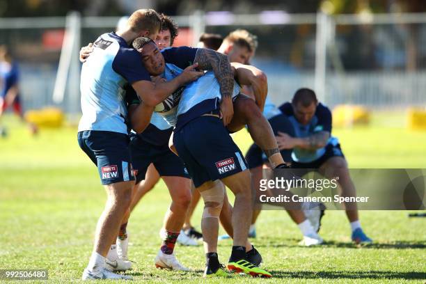Tyson Frizell of the Blues is tackled during a New South Wales Blues State of Origin training session at Coogee Oval on July 6, 2018 in Sydney,...