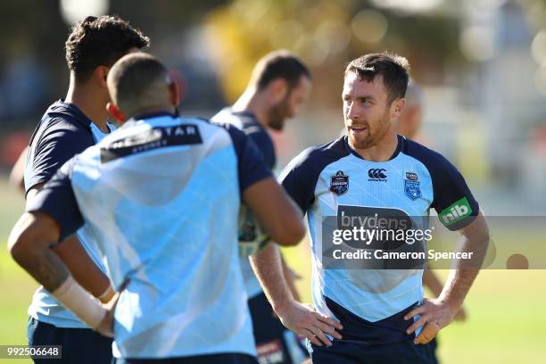 James Maloney of the Blues talks to team mates during a New South Wales Blues State of Origin training session at Coogee Oval on July 6, 2018 in...