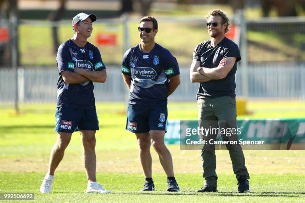 Actor Simon Baker talks to Blues assistant coach Andrew Johns during a New South Wales Blues State of Origin training session at Coogee Oval on July...