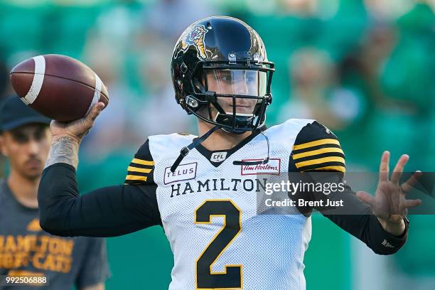 Johnny Manziel of the Hamilton Tiger-Cats throws a pass in pregame warmup before the game between the Hamilton Tiger-Cats and Saskatchewan...