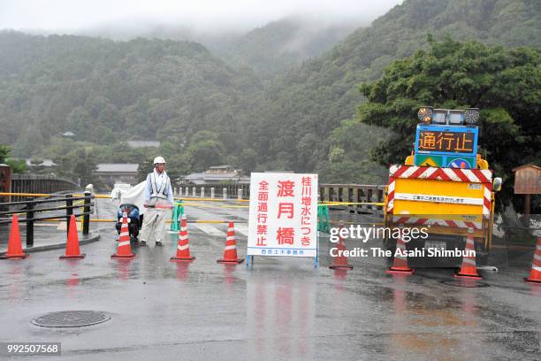 Togetsukyo Bridge is closed as Katsuragawa River is swollen due to heavy rain on July 6, 2018 in Kyoto, Japan. At least one person was killed and...