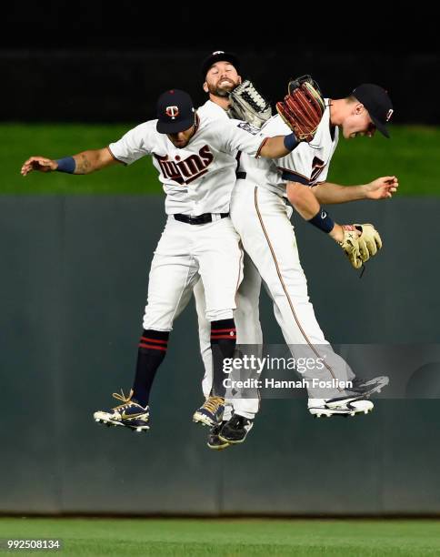 Eddie Rosario, Jake Cave and Max Kepler of the Minnesota Twins celebrate defeating the Baltimore Orioles after the game on July 5, 2018 at Target...