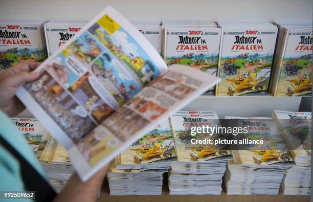 New copies of the comics "Asterix in Italy" can be seen at the book store "Wittwer" in Stuttgart, Germany, 19 October 2017. Photo: Marijan Murat/dpa