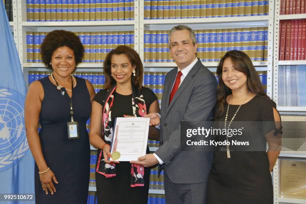 Elayne Whyte Gomez , Costa Rican ambassador to the U.N. Office in Geneva, poses at U.N. Headquarters in New York on July 5 after filing documents to...