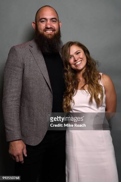 Former UFC women's bantamweight champion Ronda Rousey poses for a portrait backstage with husband Travis Browne prior to being inducted into the UFC...
