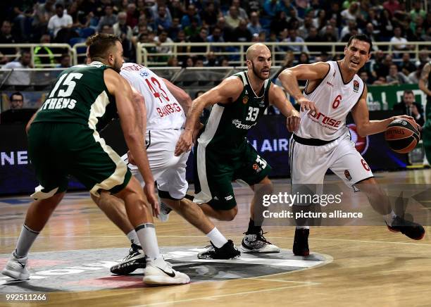 Bamberg's Nikos Zisis in action against Athens' Nick Kalathes during the Euroleague basketball match between Panathinaikos Athens and Brose Bamberg...