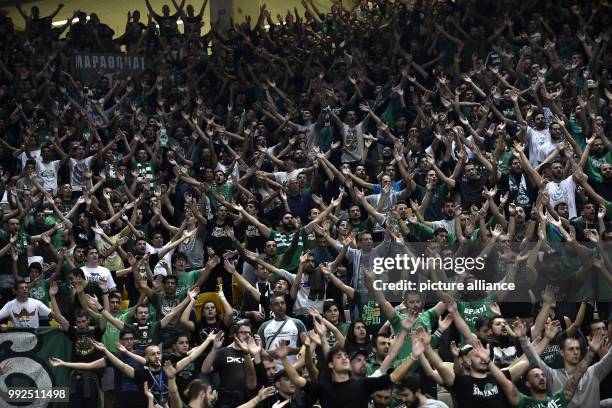 Athens' fans celebrate the 93:83 victory after the Euroleague basketball match between Panathinaikos Athens and Brose Bamberg in Athens, Greece, 19...