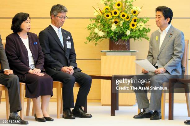 Former abductee by North Korea Hitomi Soga talks with Prime Minister Shinzo Abe during their meeting at the prime minister's official residence on...