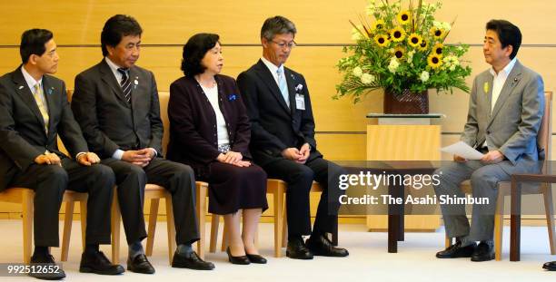 Former abductee by North Korea Hitomi Soga talks with Prime Minister Shinzo Abe during their meeting at the prime minister's official residence on...