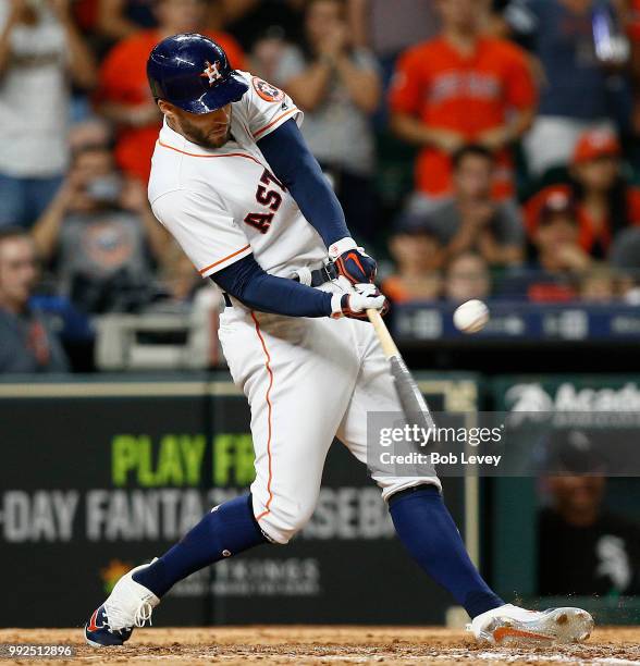 George Springer of the Houston Astros singles in the ninth inning against the Chicago White Sox at Minute Maid Park on July 5, 2018 in Houston, Texas.