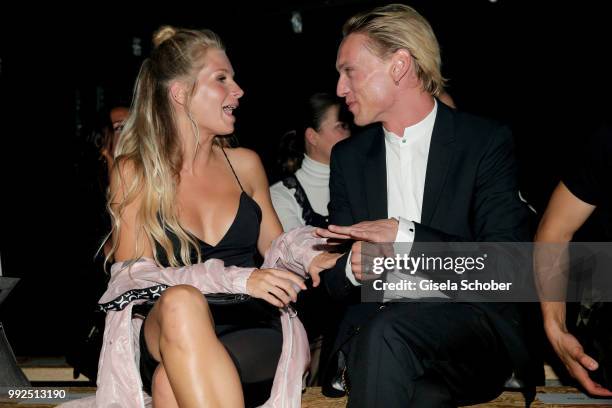 Jamie Campbell Bower, Lottie Moss, stepsister of Kate Moss, attend the HUGO show during the Berlin Fashion Week Spring/Summer 2019 at Motorwerk on...