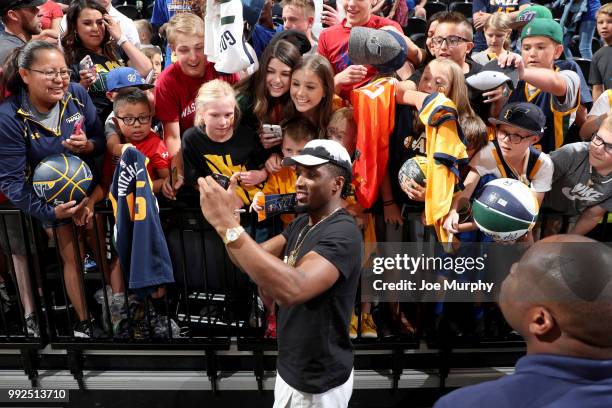 Donovan Mitchell of the Utah Jazz takes a photo with fans after the game against the Atlanta Hawks on July 5, 2018 at Vivint Smart Home Arena in Salt...