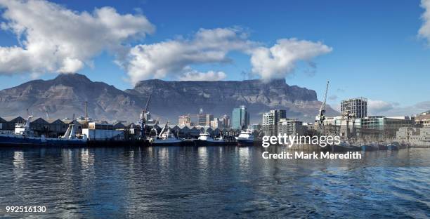 cape town harbour and docks with backdrop of table mountain and devils peak - cape town harbour stock pictures, royalty-free photos & images