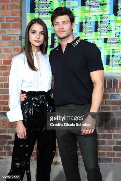 Luise Befort and her boyfriend Eugen Bauder attend the HUGO show during the Berlin Fashion Week Spring/Summer 2019 at Motorwerk on July 5, 2018 in...