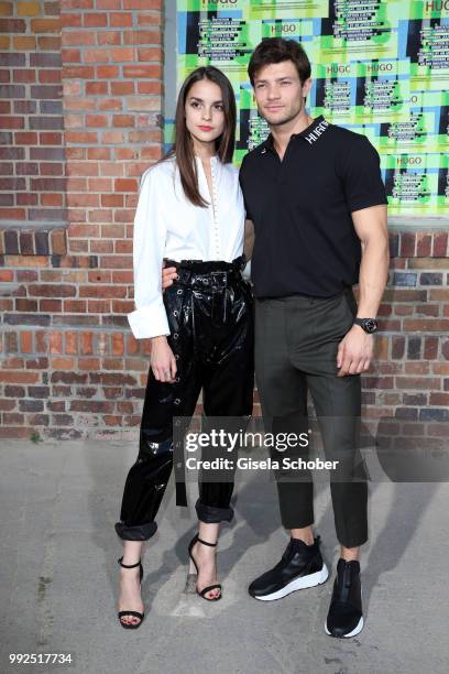 Luise Befort and her boyfriend Eugen Bauder attend the HUGO show during the Berlin Fashion Week Spring/Summer 2019 at Motorwerk on July 5, 2018 in...