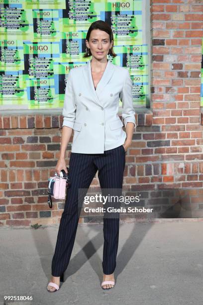Eva Padberg attends the HUGO show during the Berlin Fashion Week Spring/Summer 2019 at Motorwerk on July 5, 2018 in Berlin, Germany.
