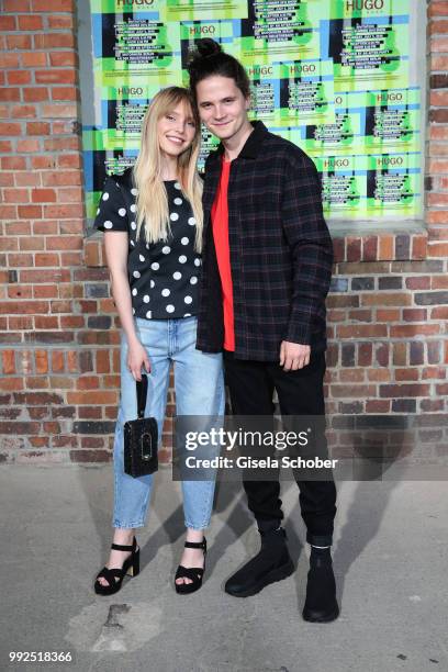 Lina-Larissa Strahl and her boyfriend Tilman Poerzgen attend the HUGO show during the Berlin Fashion Week Spring/Summer 2019 at Motorwerk on July 5,...