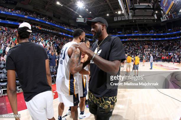Stanton Kidd and Royce O'Neale of the Utah Jazz shake hands after the game against the Atlanta Hawks on July 5, 2018 at Vivint Smart Home Arena in...