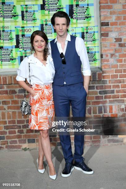 Alice Dwyer and her boyfriend Sabin Tambrea attend the HUGO show during the Berlin Fashion Week Spring/Summer 2019 at Motorwerk on July 5, 2018 in...