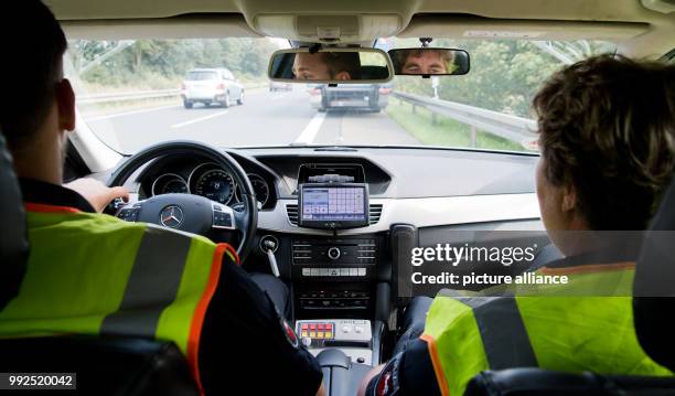 Officers of the motorway police drive on motorway A2 near Hanover, Germany, 25 August 2017. The 'Einsatz- und Streifendienst Bundesautobahn' of the...