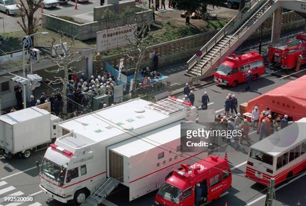 This picture taken on March 20, 1995 shows emergency teams outside Tsukiji subway station following a sarin gas attack by doomsday cult Aum Supreme...