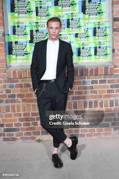 Jamie Campbell Bower attends the HUGO show during the Berlin Fashion Week Spring/Summer 2019 at Motorwerk on July 5, 2018 in Berlin, Germany.