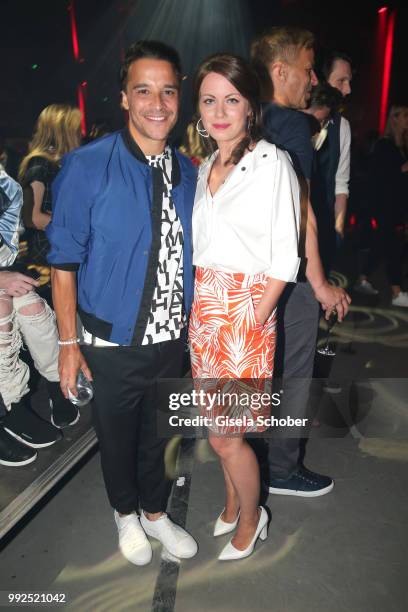 Kostja Ullmann and Alice Dwyer attend the HUGO show during the Berlin Fashion Week Spring/Summer 2019 at Motorwerk on July 5, 2018 in Berlin, Germany.