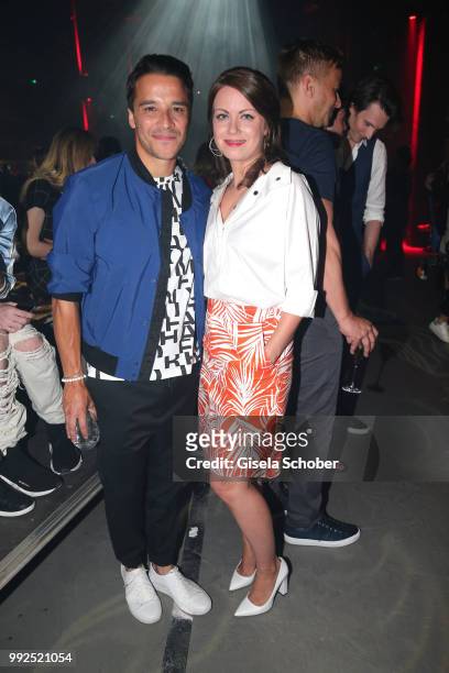 Kostja Ullmann and Alice Dwyer attend the HUGO show during the Berlin Fashion Week Spring/Summer 2019 at Motorwerk on July 5, 2018 in Berlin, Germany.
