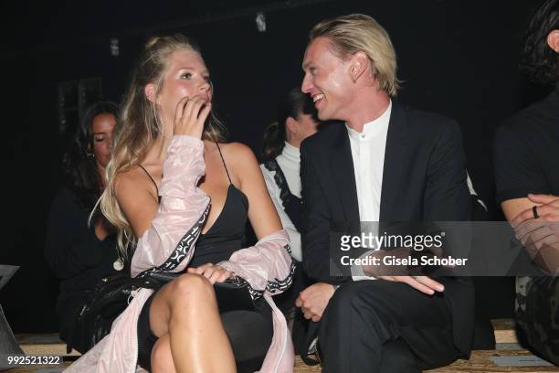 Jamie Campbell Bower, Lottie Moss, stepsister of Kate Moss, attend the HUGO show during the Berlin Fashion Week Spring/Summer 2019 at Motorwerk on...