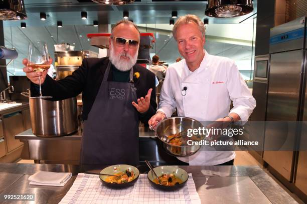 Artist Friedrich Liechtenstein and chef Bobby Braeuer pictured after eating a bouillabaisse at BMW Welt in Munich, Germany, 20 October 2017....