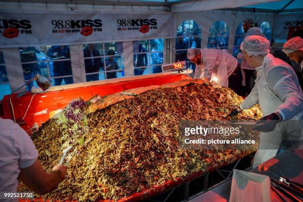 Staff from the Berlin private radio station "98.8 KISS FM" prepare to break the record for the world's largest doner kebab in Berlin, Germany, 20...