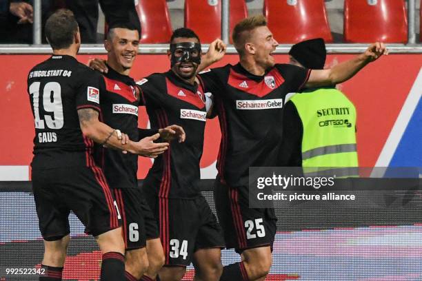 Hauke Wahl of Ingolstadt celebrates with teammates Marcel Gaus , Alfredo Morales and Marvin Matip after his goal for 1:0 during the German 2nd...