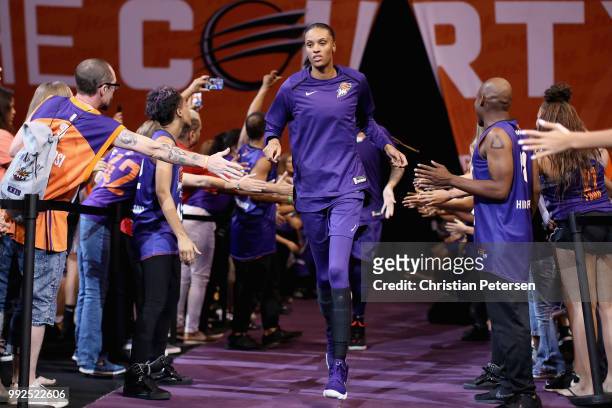 DeWanna Bonner of the Phoenix Mercury runs out onto the court before WNBA game against the Connecticut Sun at Talking Stick Resort Arena on July 5,...