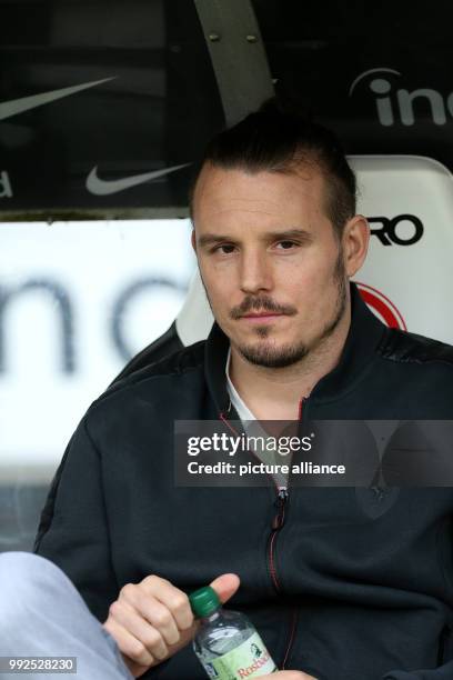 Frankfurt's Alexander Meier sits on the bench before the German Bundesliga soccer match between Eintracht Frankfurt and Borussia Dortmund in...