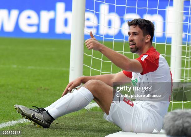 Augsburg's Rani Khediran shows a thumbs up during the German Bundesliga soccer match between FC Augsburg and Hanover 96 at the WWK Arena in Augsburg,...