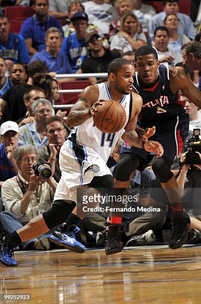Jameer Nelson of the Orlando Magic drives against Joe Johnson of the Atlanta Hawks in Game Two of the Eastern Conference Semifinals during the 2010...