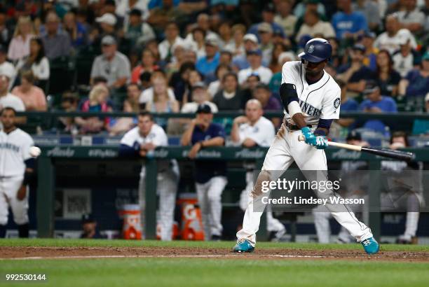 Dee Gordon of the Seattle Mariners hits a triple in the seventh inning against the Los Angeles Angels of Anaheim at Safeco Field on July 5, 2018 in...