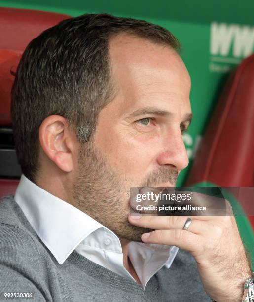 Augsburg's coach Manuel Baum seen on the bench during the German Bundesliga soccer match between FC Augsburg and Hanover 96 at the WWK Arena in...