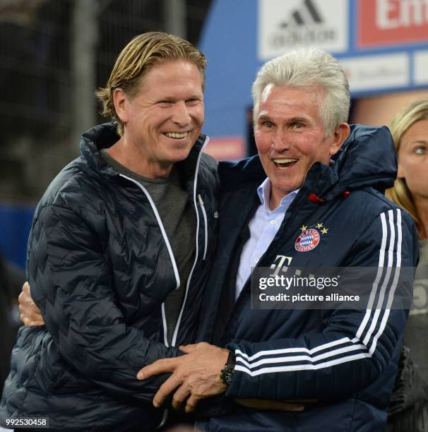 Munich's coach Jupp Heynckees and Hamburg's coach Markus Gisdol seen prior to the German Bundesliga soccer match between Hamburger SV and Bayern...