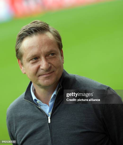 Hanover's sports director Horst Heldt reacts during the German Bundesliga soccer match between FC Augsburg and Hanover 96 at the WWK Arena in...