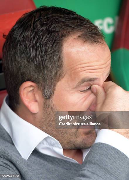 Augsburg's coach Manuel Baum reacts during the German Bundesliga soccer match between FC Augsburg and Hanover 96 at the WWK Arena in Augsburg,...