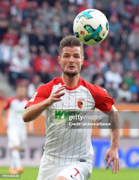 Augsburg's Marcel Heller in action during the German Bundesliga soccer match between FC Augsburg and Hanover 96 at the WWK Arena in Augsburg,...