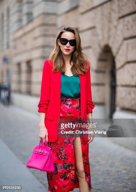 Alexandra Lapp wearing an Asian pencil skirt with a flower print from Zara, a long red Blazer with cropped sleeves from Zara, a green silk top from...
