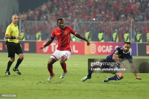 Al-Ahly's Nigerian striker Junior Ajayi vies for the ball with Etoile's player during the second-leg of the CAF Champions League Semifinal football...