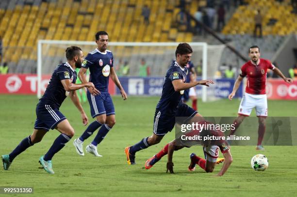 Al-Ahly and Etoile du Sahel players in action during the second-leg of the CAF Champions League Semifinal football match between Tunisia's Etoile...