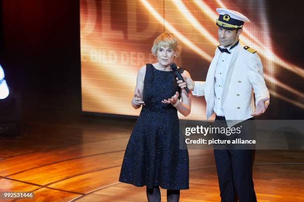 Chief editor of "Bild der Frau" Sandra Immoorer and TV presenter Kai Pflaume standing onstage during the the award ceremony of the "Goldene Bild der...