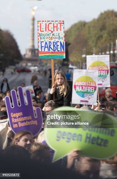 Thousands of people demonstrating with signs - a.o. With a sign reading "light needs all colours" - at the "Platz des 18. Maerz" at the...