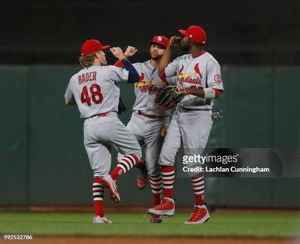 Harrison Bader, Tommy Pham and Dexter Fowler of the St Louis Cardinals celebrate after a win against the San Francisco Giants at AT&T Park on July 5,...