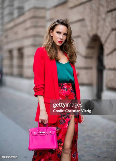 Alexandra Lapp wearing an Asian pencil skirt with a flower print from Zara, a long red Blazer with cropped sleeves from Zara, a green silk top from...